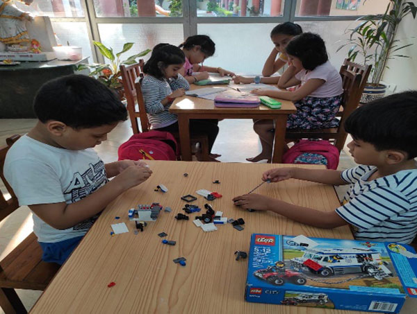 Students taking part in different activities at AMECARE after -school day boarding program of AMPS